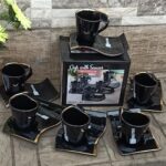 Black 12pc cup and saucer set with gold rim