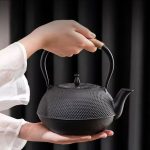 Cast iron tea pot with infuser